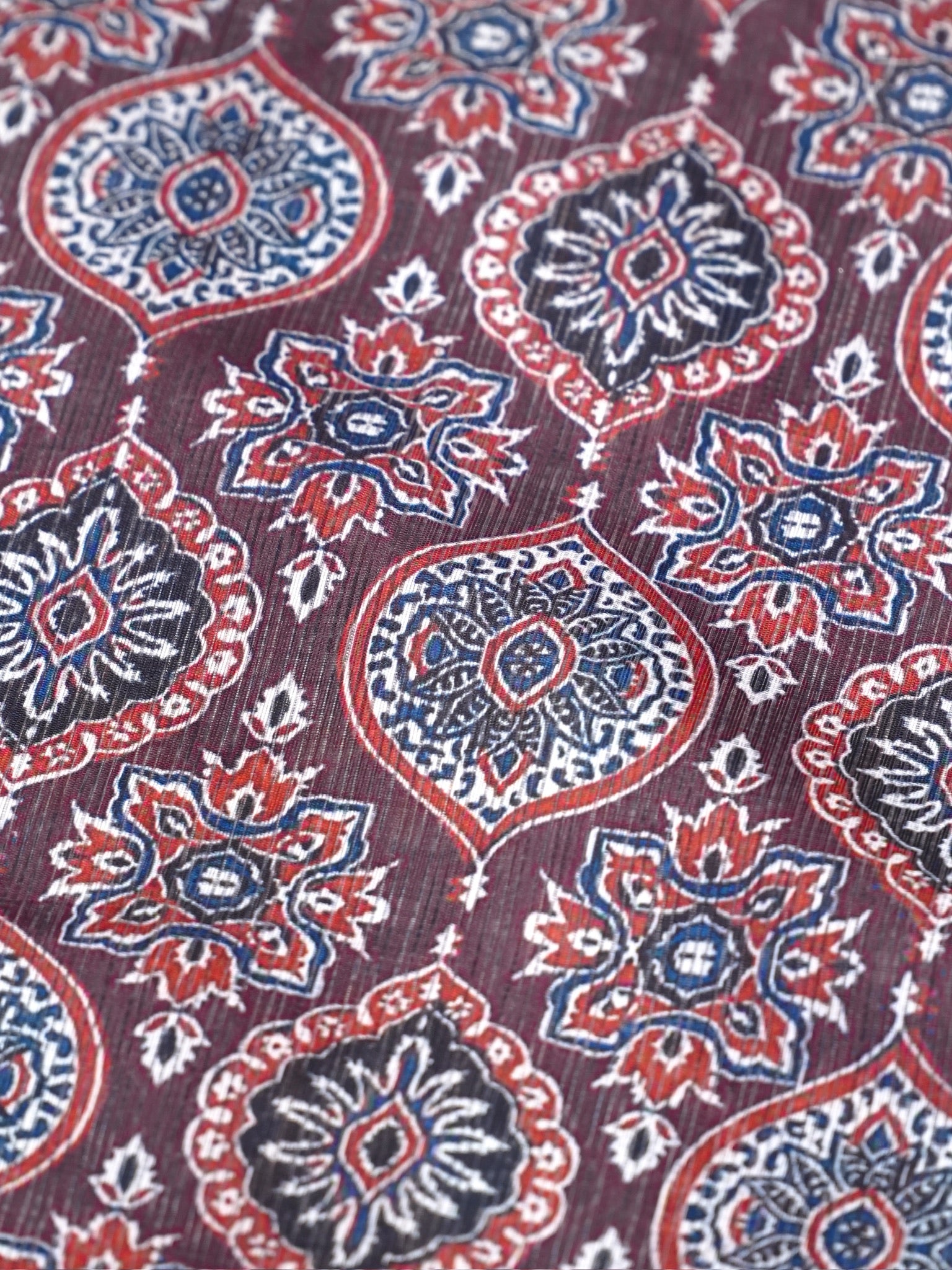 Crimson Ajrakh Printed Banarasi Soft Silk Saree with Antique Zari Border
