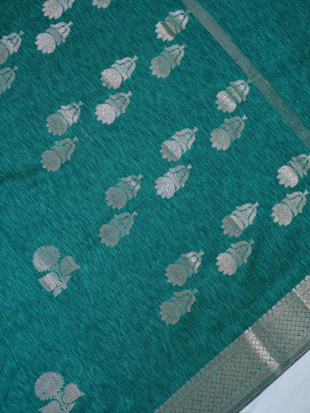 Teal Blue Soft Linen Silk Saree with Floral Silver Zari Butis & Woven Lattice Border