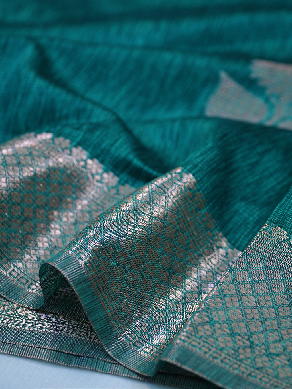 Teal Blue Soft Linen Silk Saree with Floral Silver Zari Butis & Woven Lattice Border