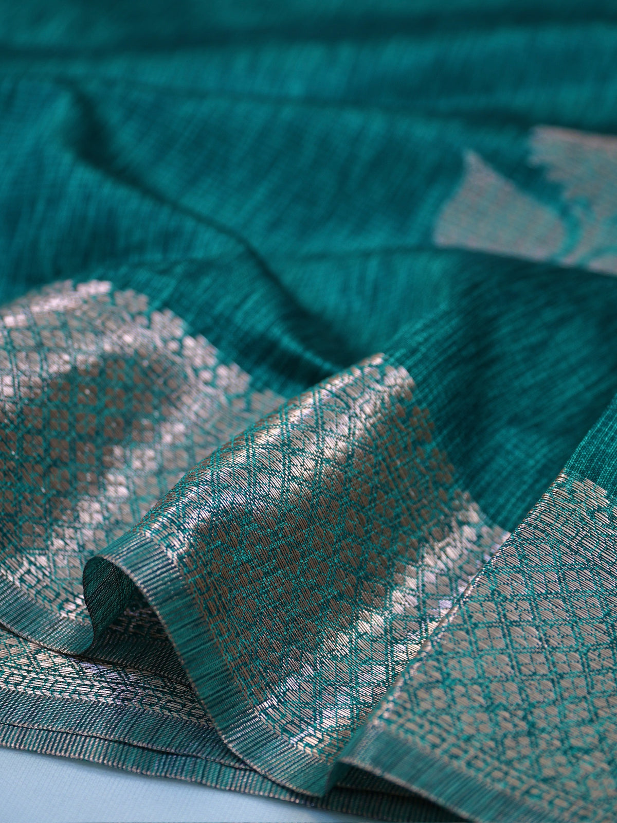 Teal Blue Soft Linen Silk Saree with Floral Silver Zari Butis & Woven Lattice Border